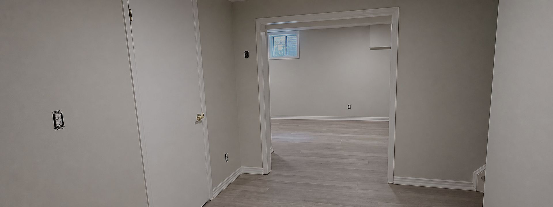 Freshly painted interior hallway with clean neutral walls and white trim